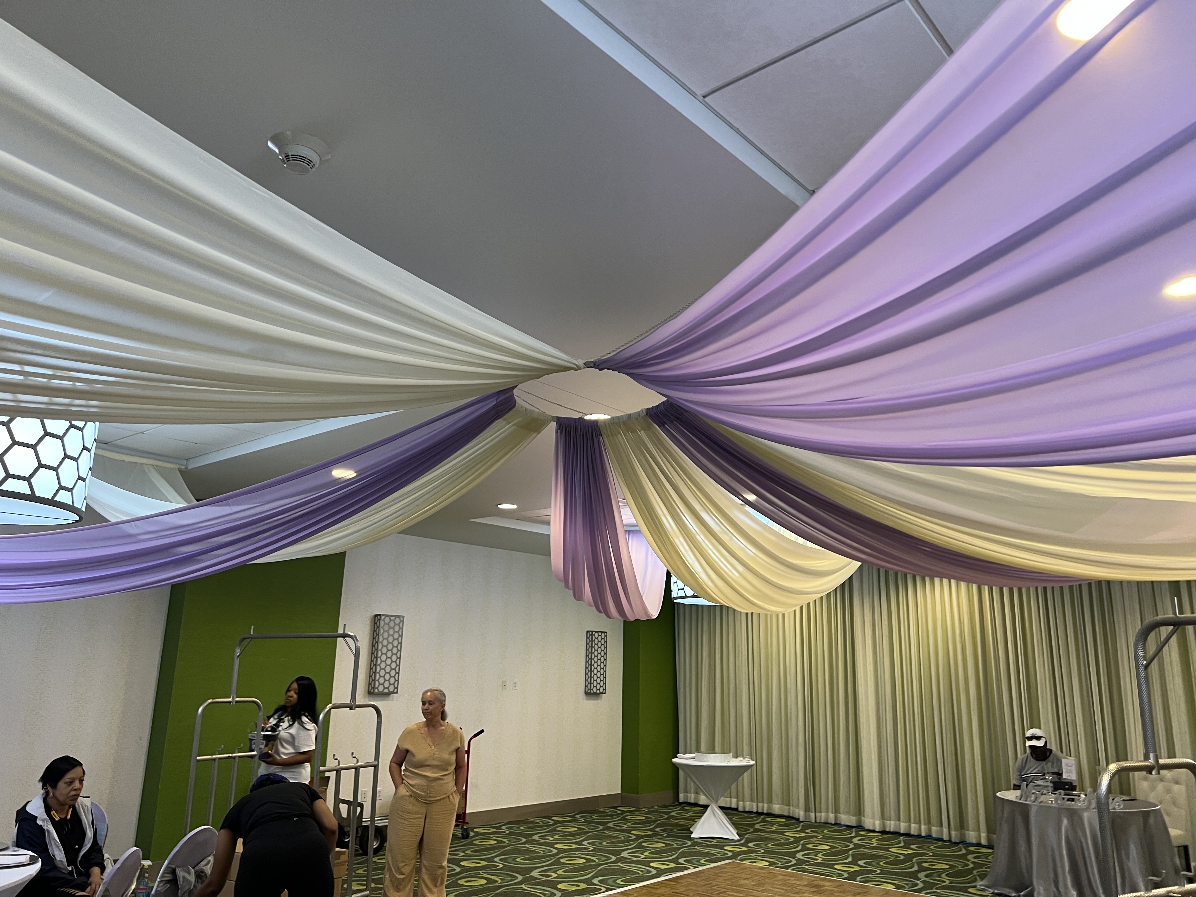 Indoor reception with white chair covers